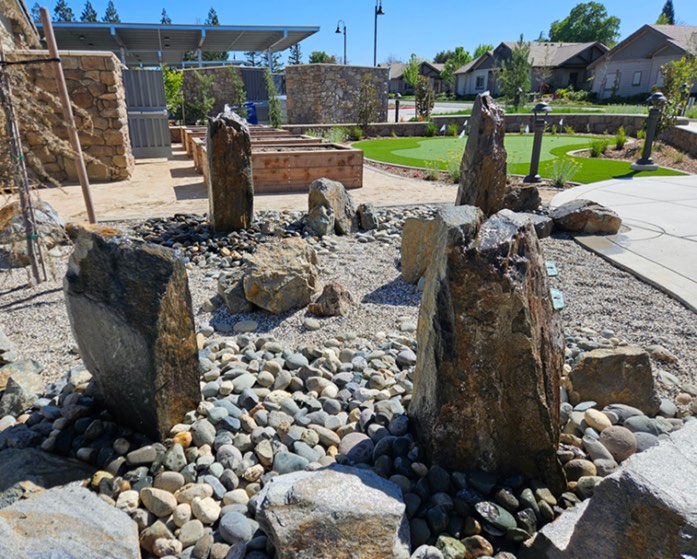 Multi boulder rock fountain custom built for senior living apartments in Auburn, California